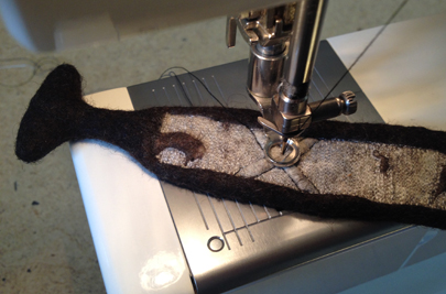 Free-motion machine embroidering in process on a cuff, (STRONGFELT works, 2013)