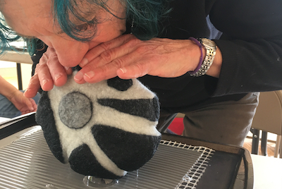 Audrey Legatowicz inflating her form to determine where and in what direction to begin fulling the felt. Form & Concept workshop in conjunction with and in the gallery space! of Lisa Klakulak's solo exhibit "Since Taos" 2019.