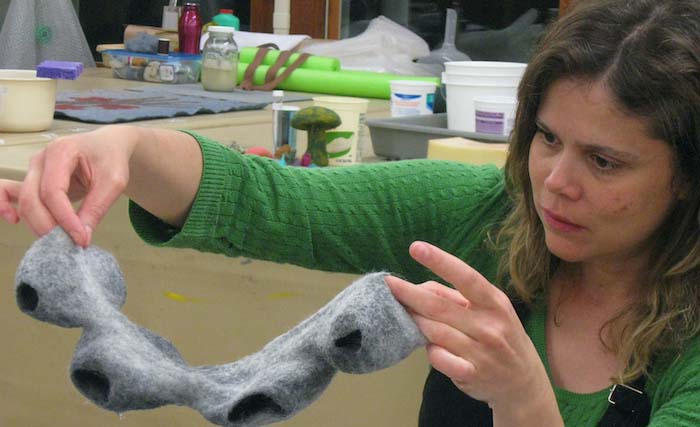 Camila Mesquita exploring template resist shapes and mutiple openings in the form, Penland School of Crafts "Felt Technical & Felt Innovative" Fiber Concentration, Penland, NC, 2011