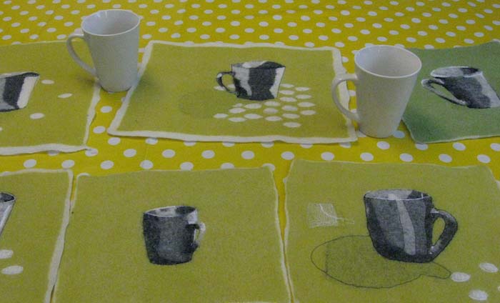 Participants' class studies of rendering a cup dimensionally in felt employing perspective, shading and free-motion stitching to sharpen details, Ullform workshop, Stavanger, Norway, 2012