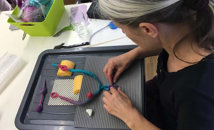 Renate Jost composing multiple solid forms into a seamless formation, Mostviertler-Werkstatt workshop, Ybbsitz, Austria, 2016