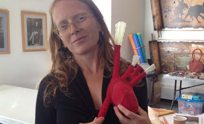 Sandy Compton's remarkable study of an anatomical heart being held by Lisa Klakulak, Galt Museum workshop, Lethbridge, Alberta, 2014