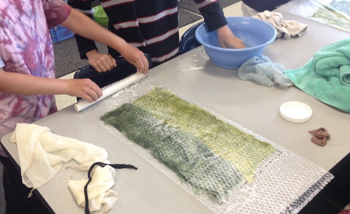 Getting students to layout two colors in the same felt so that the fibers in the middle are at a consistent thickness was a challenge and so was moderating their soap application!