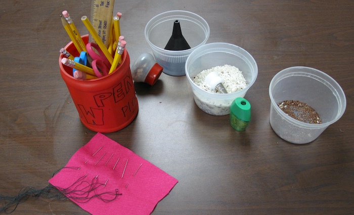 Students used a funnel or a cake decorating tip to assist in filling their hollow eggs with seeds, grains and beans after removing the deflated balloon...then came the stitching up of the hole!