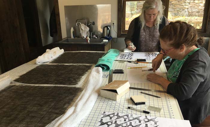 Laura Vernon Rusell & Susan Mac Lean developing patterns to cut from partial felt, STRONGFELT Studio workshop, Asheville, NC, 2016