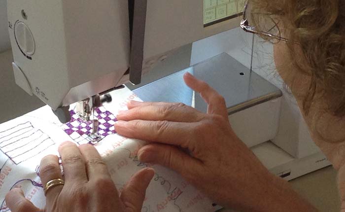 Kate Veness-Meehan practicing free-motion machine stitching control on Tyvek, STRONGFELT Studio, 2014