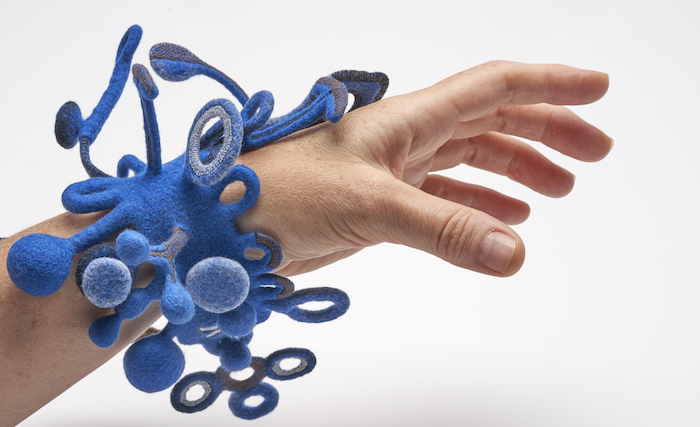 STRONGFELT work, "Blue Reach," a study of multiple clasping and closure mechanisms connected to a 2D cuff base, 2017