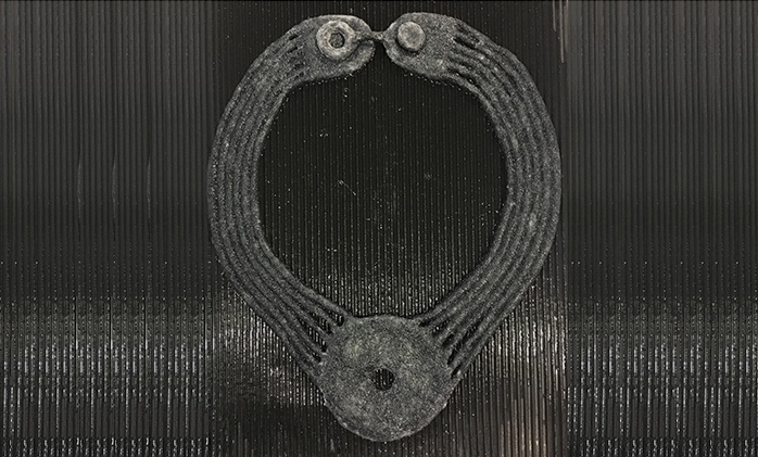 STRONGFELT work, "Gather, Coil," connecting multiple cords of .2" diameter to partial felt shapes for pendant and clasp, 2016