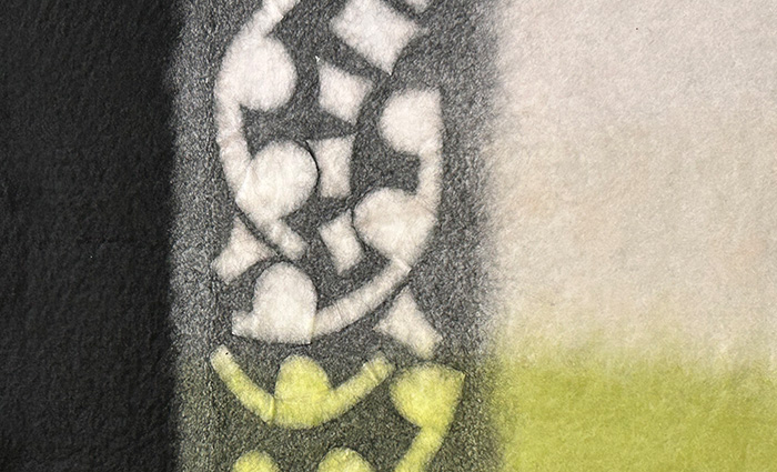 STRONGFELT work demonstrating use of resists to create surface textures through reverse cutting and to block color blending in specified areas for defined surface patterning