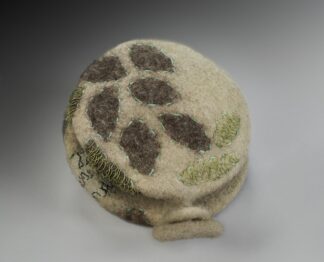 Round felted container with embroidered leaf motifs